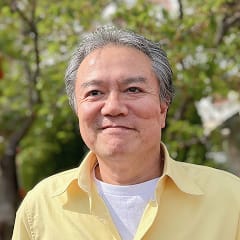 法人事務担当、金山重之さんの写真